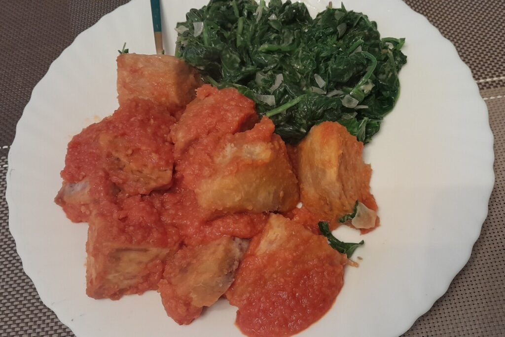 Arrowroot in tomato sauce and creamed spinach